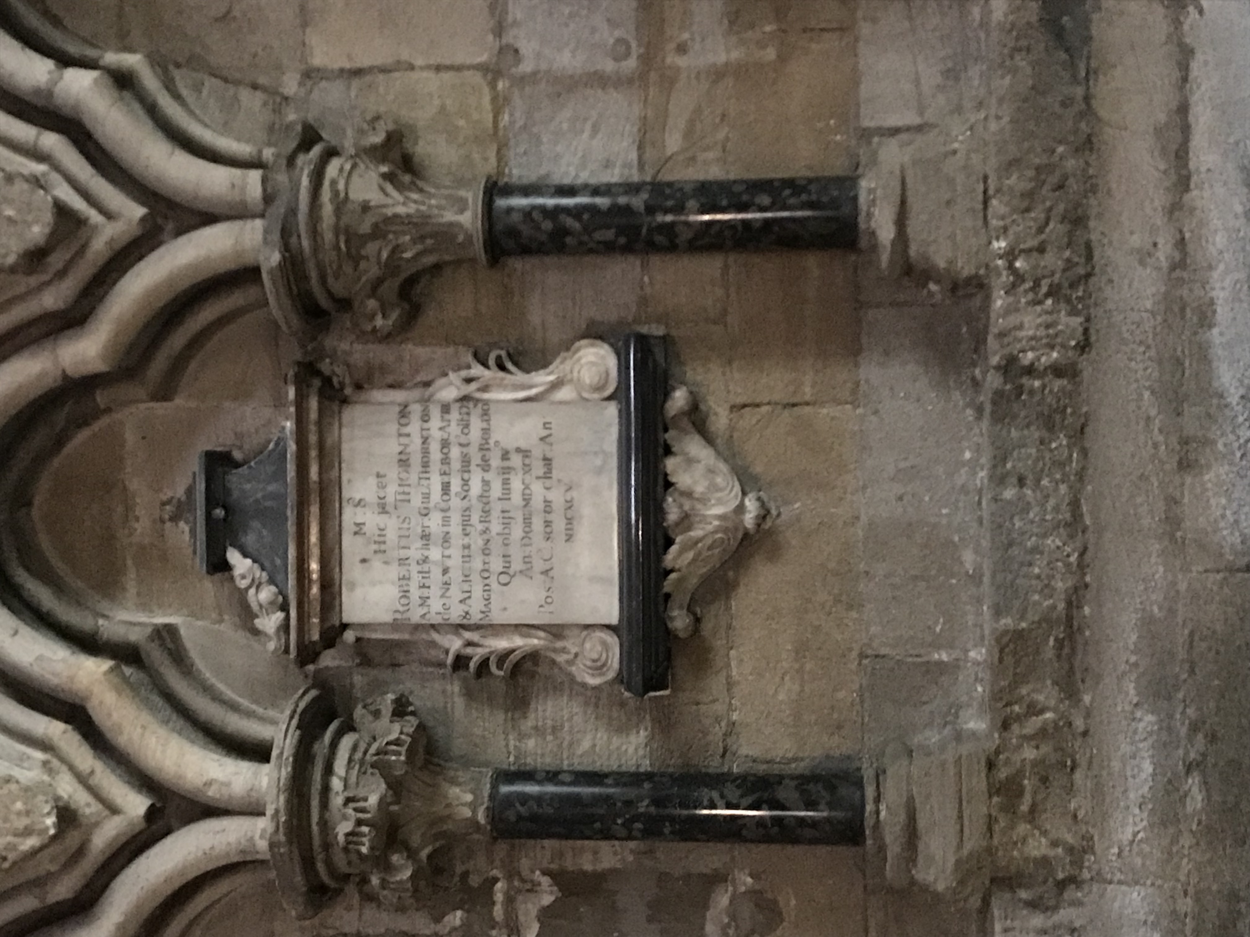 A marble memorial plaque on a cathedral wall